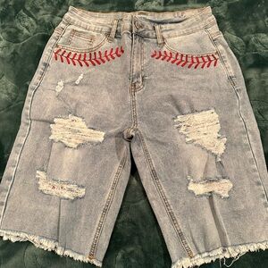 Stylish Distressed Denim Shorts with Red Stitching